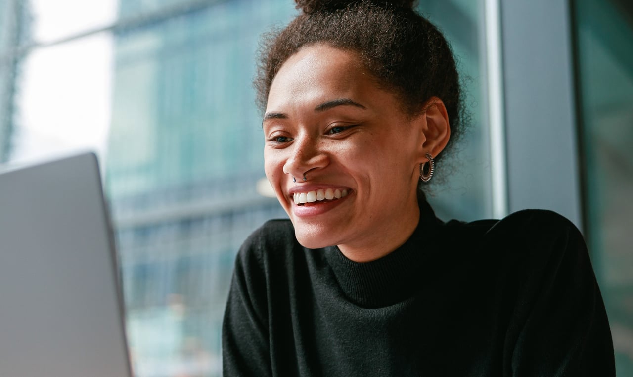 Person looking at laptop screen.