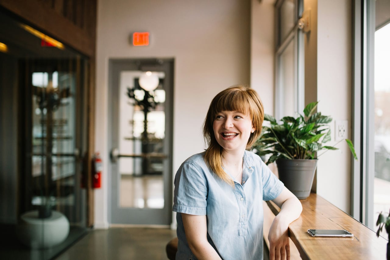 Student sitting at counter in modern coworking space